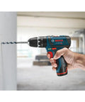 12V Max 3/8 Inch Hammer Drill Driver Bare Tool for Pros being used to drill into concrete wall