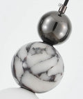 Aolyzmt Natural Alabaster Marble Pendant Light, Modern Cylinder LED Hanging Lamp with black gold sphere and natural marble detail.