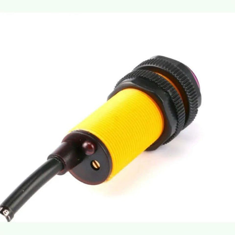 Infrared Photoelectric Switch Obstacle Avoidance Sensor Module E18D80NK shown from side with cable and adjustable focus