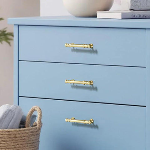 Minimalist Bright Gold Aluminum Alloy Cabinet And Wardrobe Handles Set Six Pack installed on blue drawers with 3.78 inch hole spacing