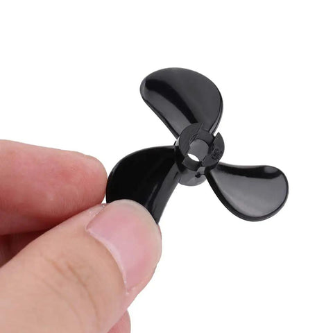 Close-up of a black lightweight plastic 3-blade RC Boat Propeller Set With 4mm Shafts Lightweight Plastic Outboard Propeller Pair
