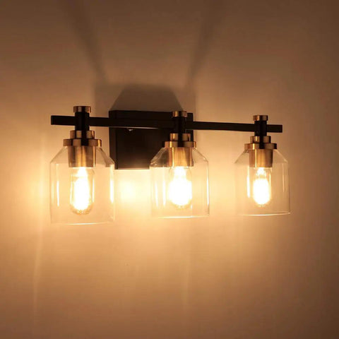 Three Light Industrial Bathroom Vanity Sconce With Black Gold Finish Matte Black Brushed Gold Copper Accent Socket Clear Glass Shade Sleek Dope Modern Farmhouse Bath Lighting