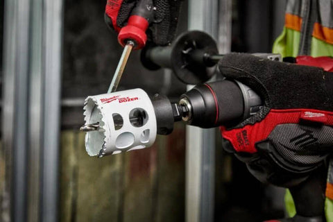 Milwaukee 4-inch ice-hardened hole saw attached to cordless drill