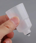 Two Pack Bike Brake Bleed Funnel With M5 Threaded Spout for Shimano Hydraulic Systems, mineral oil compatible, held in hand.
