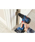 Using GSB18V-490B12 18V EC Brushless Half Inch Hammer Drill And Driver Kit with 2 Ah Battery on door hinge for home improvement