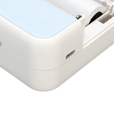 Close-up of the Banapoy Inkless Bluetooth Thermal Label Maker Machine with five rolls, showcasing its compact design and ports.