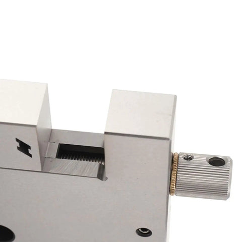 Close-up of High Precision 4 Jaw Wire Cut EDM Vise in stainless steel, 4 inch clamp, showing manual screw lock mechanism.