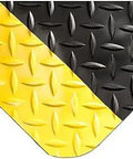 Close-up of a Diamond Plate Select UltraSoft Anti Fatigue Mat 7 Foot Long By 2 Foot Wide By Fifteen Sixteenth Inch Thick Black With Yellow Non Slip Surface.