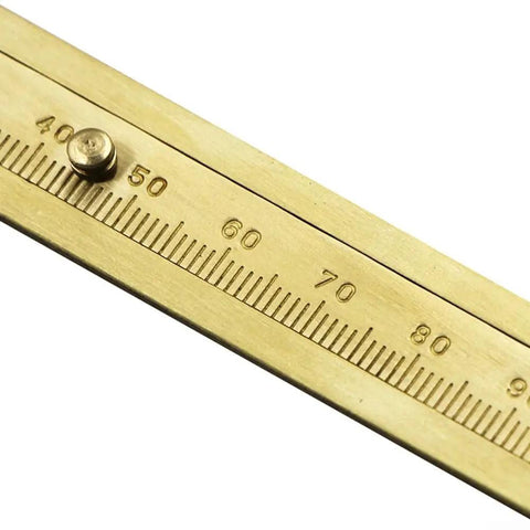 Close-up of Vernier Caliper Set 80 100mm Sliding Gauge Ruler With Double Inch And Metric Scale For Jewelry Making, brass detail