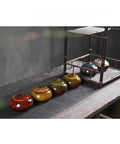 Sweet Ceramic Tea Canister For Loose Leaf Bin Plus Kitchen Pantry Setup, colorful airtight jars on a wooden table.