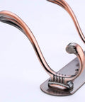 Close-up of Heavy Duty Stainless Steel Wall Coat Rack With Five Sturdy Hooks for Coats Hats Robes and Towels.