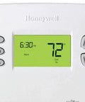 Close-up of Programmable 7 Day Thermostat With 4 Daily Programs, showing green digital display with current temperature set at 72°F.