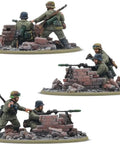 Bolt Action Rattenkrieg German Veteran Infantry Starter Army with soldiers behind brick walls, unassembled and unpainted miniatures for wargaming