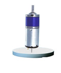 22 Mm Micro Heavy Duty Planetary Gear Motor Packing Beast Mode Torque And Zero Lag Response 12V Or 24V Dc Reversible 30 Rpm upright on a stand.