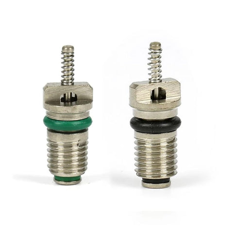 Close-up of R134A valve core kit with 6 green and 6 black Schrader stem cores for car AC systems, leakproof, high pressure, premium rubber copper construction