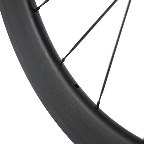 Close-up of Carbon Road Wheelset 700c 38 50 60 88mm Deep Rim Tubeless Ready 25mm Width With Basalt Braking Surface Shimano 8 9 10 11 Compatible