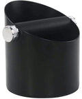 Sleek Matte Black Espresso Knock Box Featuring An Oblique Mouth And Heavy Duty Rubber Lever Stands As A Dope Under Counter Grounds Catch Tamping Station Engineered To Kill Noise For Coffee Crews, side view.
