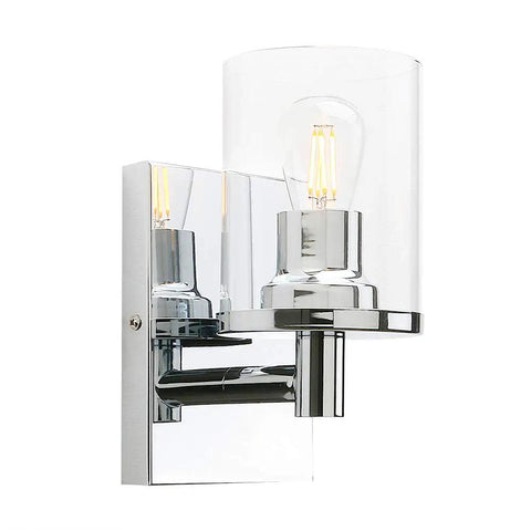 Super Cool Vintage Style One Light Wall Sconce With Clear Glass Shade And Metal Base In Chrome Perfect For Creating An Industrial Vibe In Your Bathroom Vanity Mirror Bedroom Hallway Kitchen Hardwired Wall Mount Light Fixture, side view with clear glass shade highlighting chrome base and bulb.