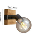 Slick Adjustable Metal And Wood Wall Sconce Vintage Industrial Farmhouse Light No Hassle Mount For Hallway Bedroom Stairs Heavy Duty Frame on wooden mount with glass bulb.