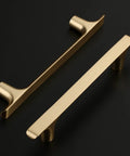 Brushed Gold Cabinet Pulls Pack Of 10, 5 Inch Hole Centers, Zinc Alloy And Brass Construction, two cabinet handles on black background