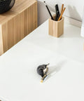 Vintage Bronze Ball Caster Wheels With Locking Brakes For Furniture on a white desk for seamless mobility and style.