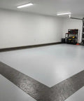 Garage floor with concrete border created using Durable Polyurethane Concrete Texture Roller For DIY And Pro Grade Projects 3 By 3 By 9 Inches Texturing Tool For Walkways Patios And Borders Concrete Stamping Roller Made In USA Long Lasting Imprint.
