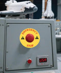 Emergency Stop Ring Replacement Button Cover for Push Button Switches installed on control panel, yellow plastic safety ring, industrial use