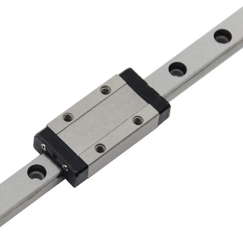 MGN9H Linear Motion Carriage Block For 9mm Slide Rail Guide mounted on a metallic rail, showcasing robust construction and smooth operation.