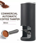 Pro Grade Electric Coffee Tamper With Digital Pressure Gauge 58mm Stainless Steel Barista Tool For Home Shop Espresso Prep Makes Pulling Shots A Breeze Quick Setup Black, showing black automatic tamper and coffee portafilter.
