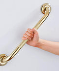Hand holding a Textured Shower Grab Bar 16 Inch Bathroom Support Rail With Polished Brass Finish Stylish Safety Armrest Hand Rail For Seniors
