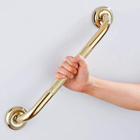 Hand holding a Textured Shower Grab Bar 16 Inch Bathroom Support Rail With Polished Brass Finish Stylish Safety Armrest Hand Rail For Seniors
