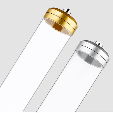 Wall Mounted Coffee Bean Dispenser And Tea Jar Keeps Your Daily Grind Locked Tight For Quick Grab Access While Saving Precious Counter Space With A Smooth Clear Display Rack In Sleek Silver Finishes. Two transparent tubes with gold and silver tops.