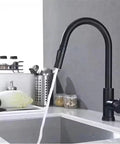 Black Pull Out Deck Mounted Flexible Hot Cold Stream Shower Modes Nozzle Faucet in a modern kitchen with running water.