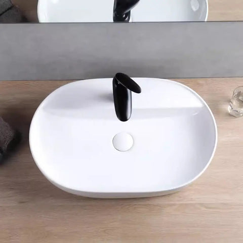 USZWBY Vessel Sinks Minimalist Ceramic Table Basin Home Hotel Bathroom Washbasin shown from above with black faucet.