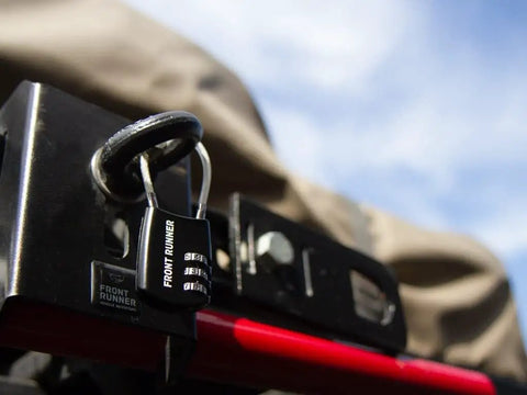 Small Stainless Steel Combination Cable Lock For Overland Truck Racks Custom Combo Code on a black mount with a red bar.