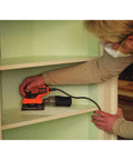 Person using Powerful Two Point Zero Amp Orbit Sander For Serious Finish Work On Wood Metal And Plastic One Hand Use With Slick Soft Paddle Switch