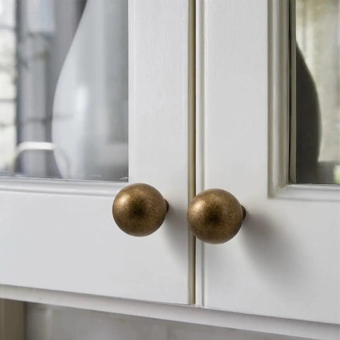 10 Pack Antique Brass Cabinet Knobs 0.9 Inch Round Solid Zinc Alloy Vintage Dresser Drawer Pulls For Closet Cupboard Wardrobe Aged Bronze Finish Easy Install Durable Hardware Retro Vibe on white cabinets