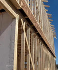 Wood frame construction showcasing structural support for Hurricane Tie H2.5A 18 Gauge Galvanized Structural Tie installation.