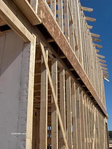 Wood frame construction showcasing structural support for Hurricane Tie H2.5A 18 Gauge Galvanized Structural Tie installation.