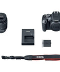 Rebel T7 DSLR Starter Kit With 24.1MP APS-C Sensor And Built-In Wi-Fi NFC 18-55mm Lens 64GB Card Shoulder Bag Battery And Charger Eyecup Body Cap Ideal Beginner Photography Setup contents including camera, lens, battery, charger, strap.
