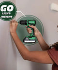 Person using Beast Cordless Drill 18V One Half Inch Subcompact Brushless Driver with lightweight design on wall