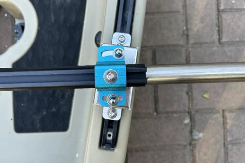 Close-up of Kayak Stabilizers Package mount with anodized aluminum cross bar and adjustable system for fishing kayaks.
