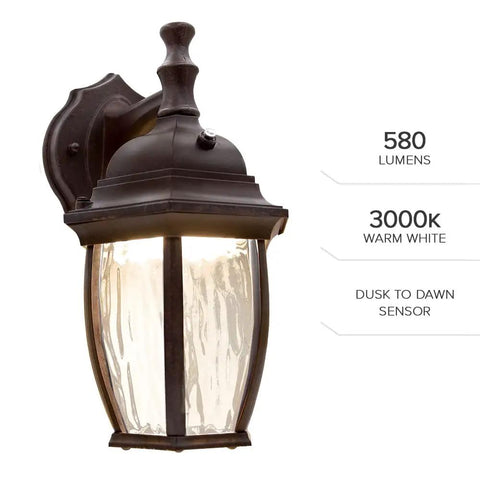 Outdoor Wall Light Sconce With Dusk To Dawn Sensor, 580 Lumens Warm 3000K Glow, Clear Water Glass, Aged Bronze Aluminum Base