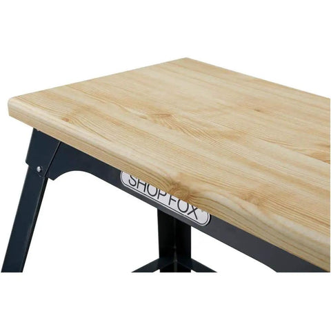 Close-up of the 13x23 inch butcher block top of the Beefy 13 By 23 Inch Butcher Block Tool Table With 700 Pound Capacity And About 30 Inch Tall Vibration Reducing Cross Braced Benchtop Stand For Chop Saws Drill Presses Planers And Scroll Saws.