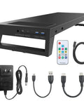 Slick Multifunctional Pc Dock Pro Intelligent Monitor Stand with black hub, ports, cables, and remote for desktop use.