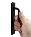 Hand holding Two Pack Self Stick Adhesive Cabinet Door Handles For Kitchen Cabinets Dressers Closets And Sliding Doors Black 148mm