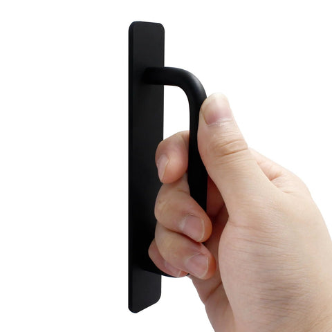 Hand holding Two Pack Self Stick Adhesive Cabinet Door Handles For Kitchen Cabinets Dressers Closets And Sliding Doors Black 148mm