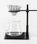 Elevate Your Daily Grind With This Slick Adjustable Pour Over Coffee Stand And Aluminum Dual Filter Cup Holder, showing adjustable setup with glass cup.