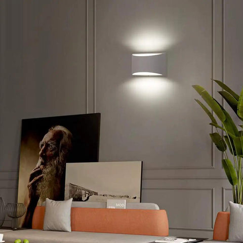 Aluminum Modern LED Wall Sconce Set Of 2 Dope Hardwired Up And Down Wall Mount Lights in a living room, soft cool white glow