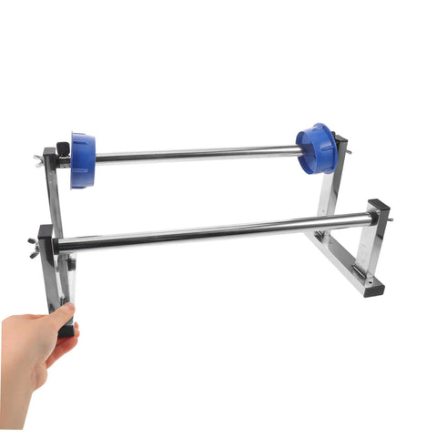 Hand Operated Unwinding Frame For Stretch Wrap Film Dispenser Tabletop Wrap Dispenser Machine Heavy Duty Metal And Plastic Construction Easy Winding And Lock Mechanism Ideal For Cargo Packing Moving And Packaging, shown with hand